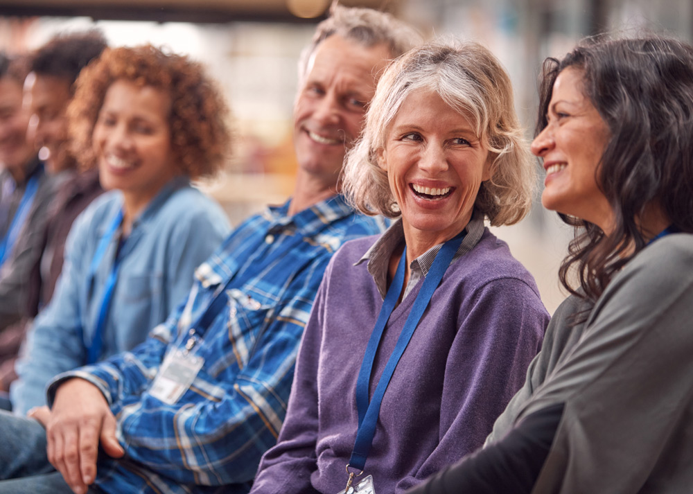 laughing-group-of-colleagues-at-a-conference-2026-01-05-23-02-09-utc